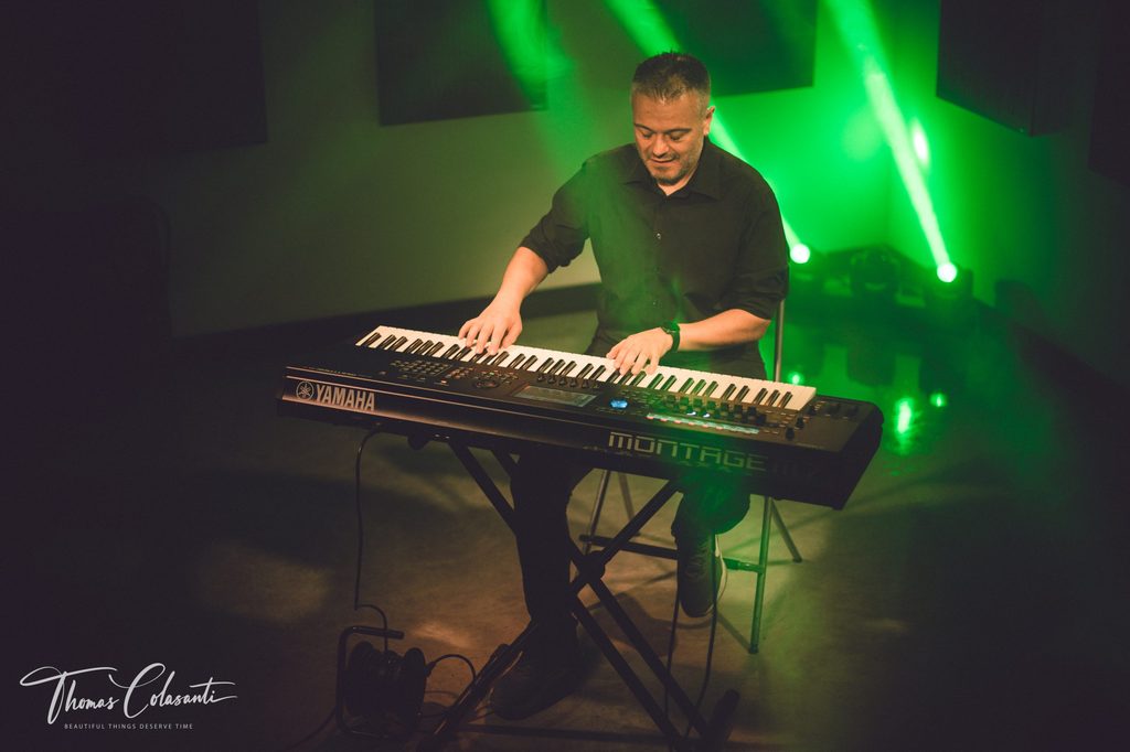Manuele Montesanti on stage at his keyboards