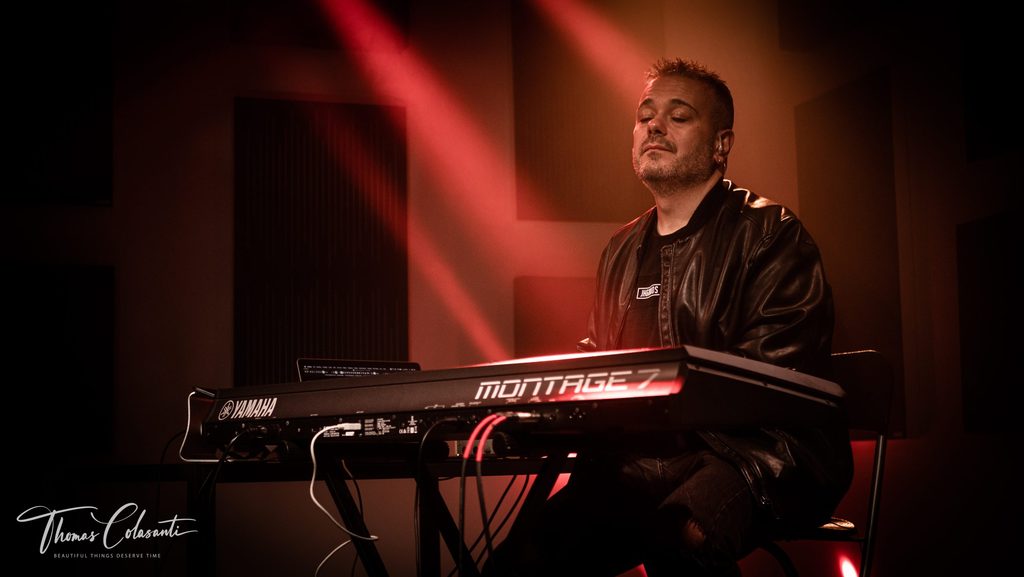 Manuele Montesanti playing keyboards on stage