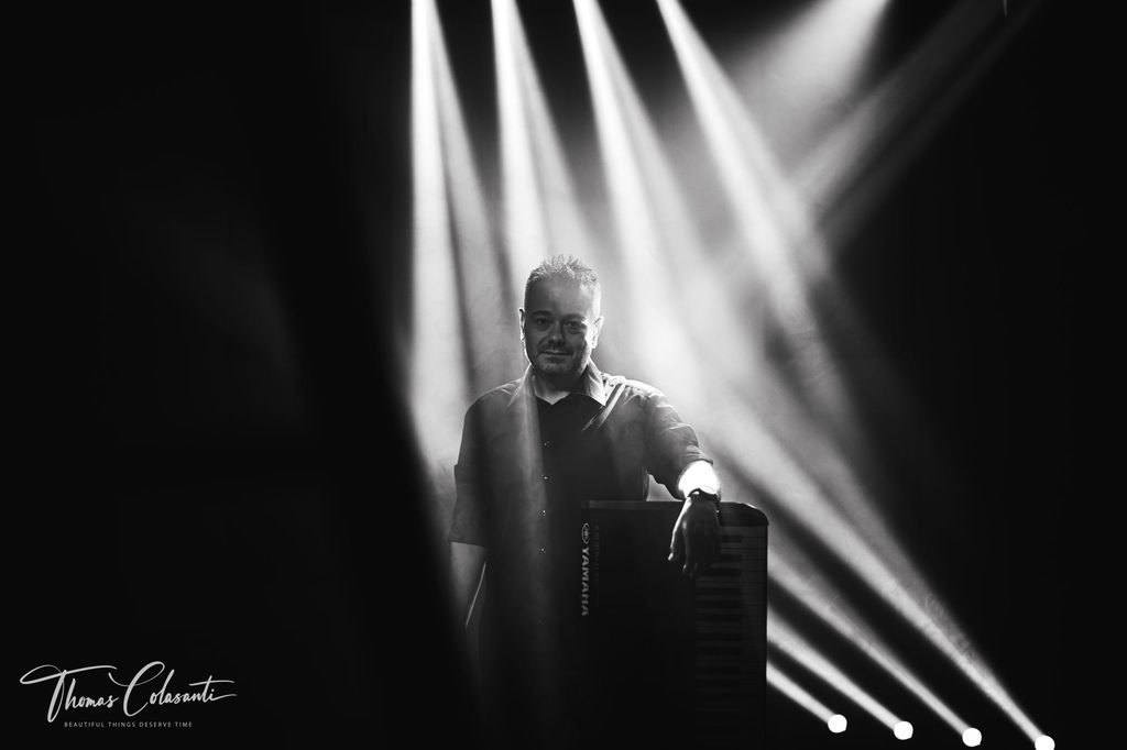Manuele Montesanti live performance with colored stage lights