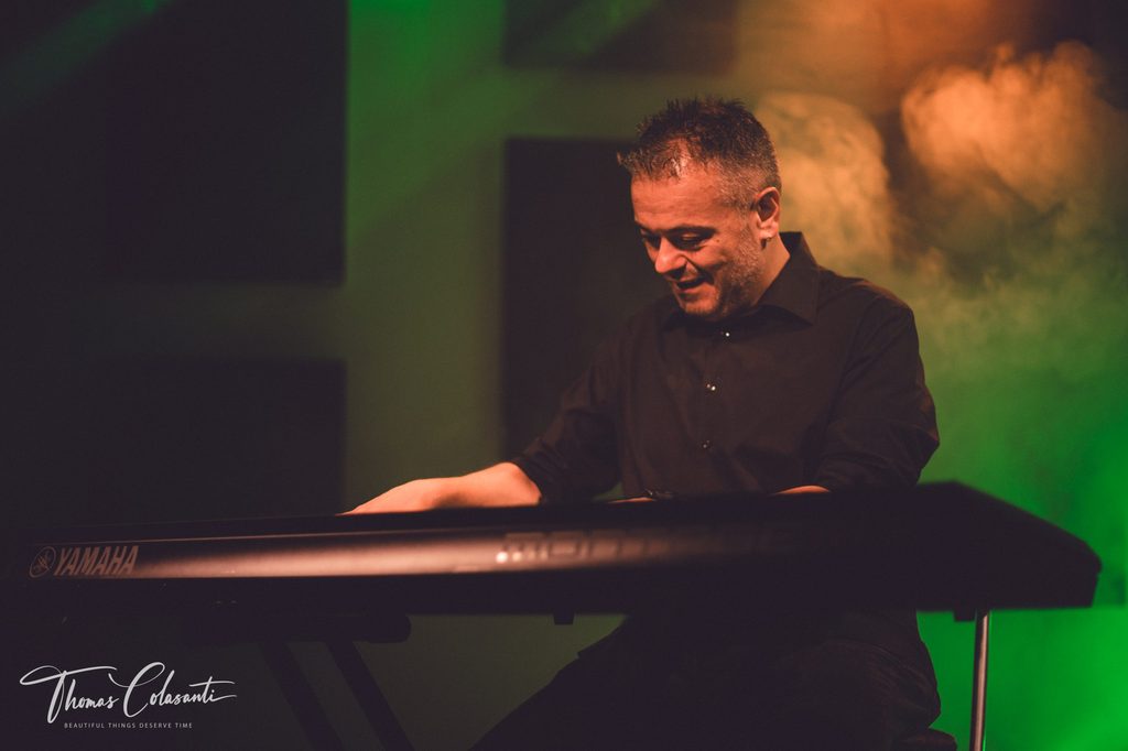 Manuele Montesanti performing with stage lights